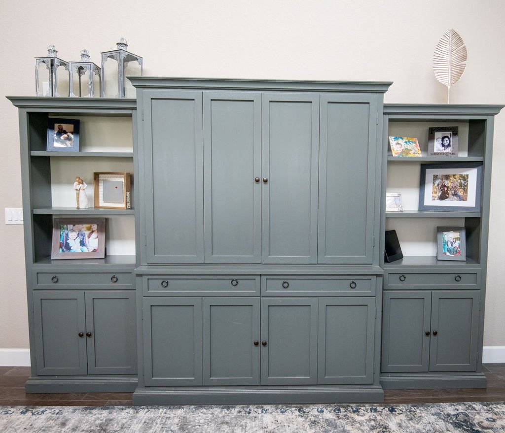Sage entertainment center with concealed TV storage, Blackstone family room renovation in Aurora, Colorado