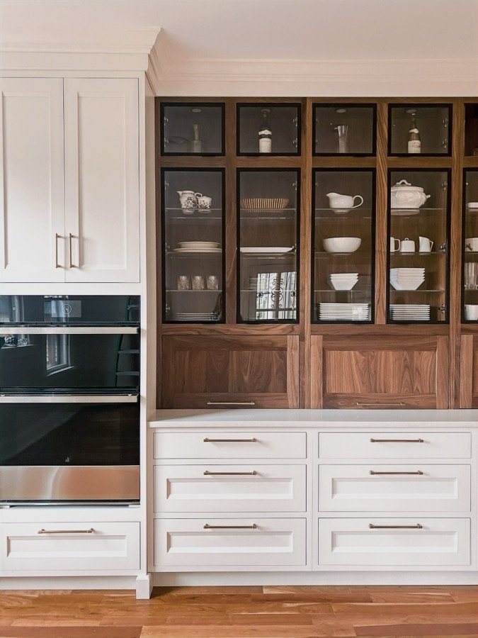 White inset cabinetry with walnut-and-glass upper display hutch, historic Colorado Springs kitchen remodel