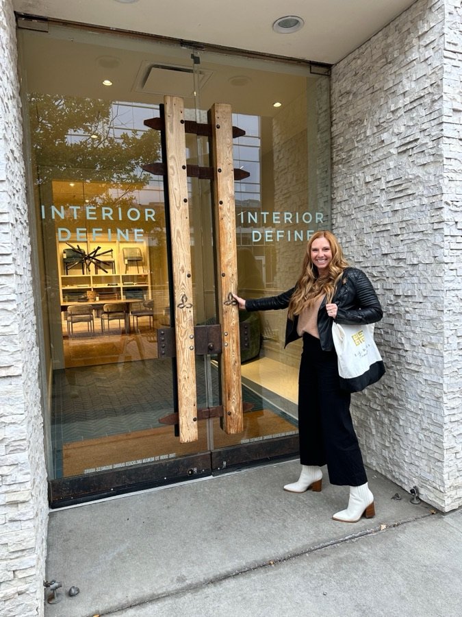 Kendra Stewart of E+E Design Consulting sourcing furnishings at a design showroom